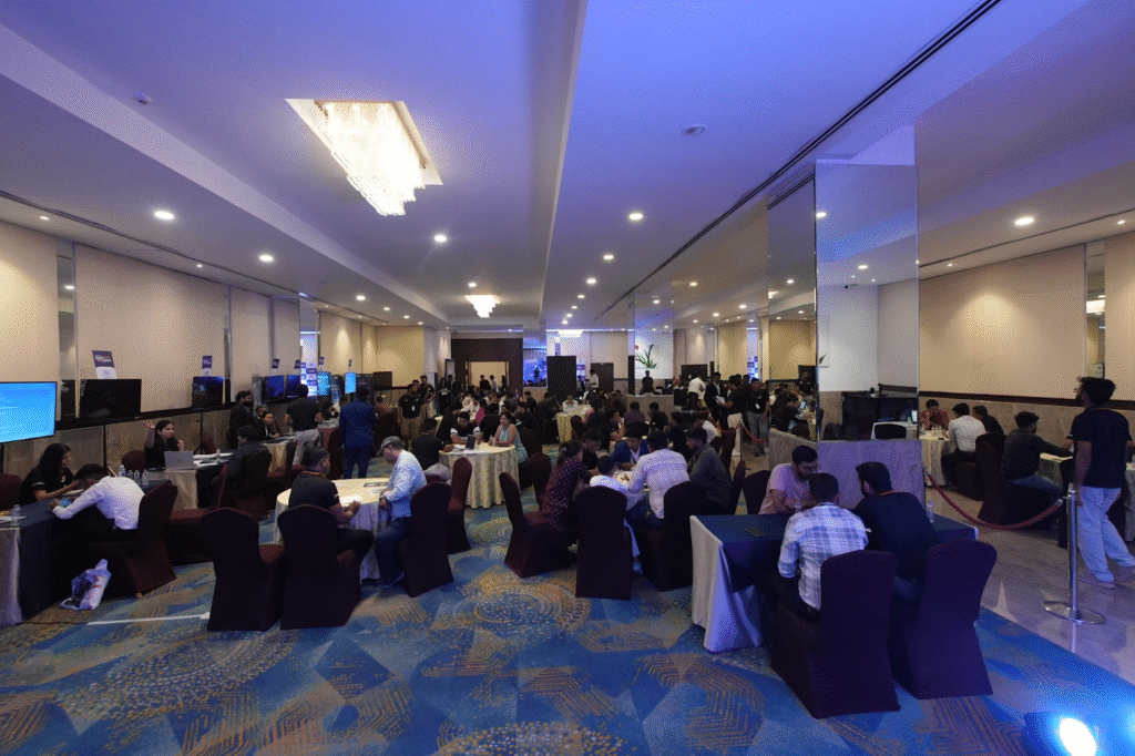 People sitting around table discussing business at an expo event